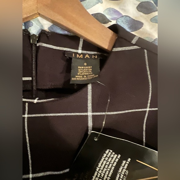 Iman long sleeved dress with fluted sleeves. Black with a white plaid pattern. - Picture 2 of 2